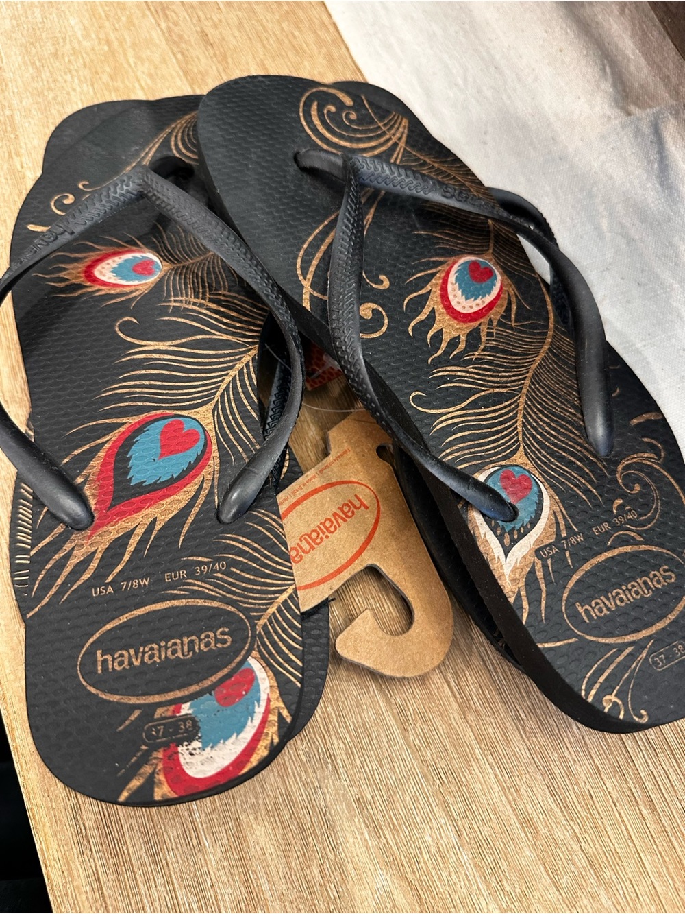 Havaianas Black Flip Flops with Gold and Teal Peacock Design